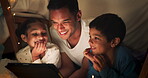  Funny, tablet and father with children in a tent house streaming internet video, show or movie online in the night. Dark, digital and parent or dad relax with kids watching comedy in the evening