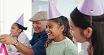 Happy, family and girl in park for birthday, celebration and party event outdoors for social gathering. Friends, lunch and mother, grandfather and children at picnic with cake, presents and surprise