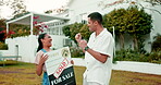 Property, high five and a homeowner couple with a sold sign in the garden of their new house together. Love, mortgage or real estate with a married man and woman in celebration of home ownership