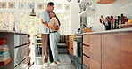 Love, dance and a happy couple in a kitchen at home with happiness, care and romance. Young woman and a man together in an apartment to hug, relax and bond for quality time, security and commitment