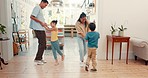 Home, family and parents with kids, dance and celebration with energy, streaming music and playful. Dancing, mother and father with children, bonding and quality time with love, wellness and happy