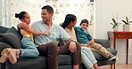 Family hug, happy and talking on the sofa with love, care and bonding in a house together. Excited, relax and young parents with affection for children and conversation on the living room couch