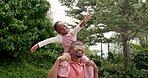 Black man, child and smile for piggyback at park, garden and nature with playful kid. Dad carrying happy young girl on shoulders outdoor with energy, flying and airplane game with love, care and bond