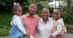 Backyard, black family and happy parents with children excited for property, home and mortgage. Real estate, new house and portrait of mom, dad and kids in neighborhood for bonding, relax and love