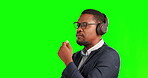 Music, thinking and business with black man on green screen for streaming, audio and media. Headphones, corporate and technology with person on studio background for podcast, sound and mockup
