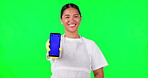 Asian woman, housekeeper and phone mockup on green screen in advertising against a studio background. Portrait of happy female person, maid or cleaner show mobile smartphone app with tracking markers