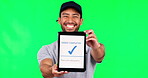 Asian man, tablet and green screen for payment success or transaction against a studio background. Portrait of male person or delivery guy show technology app, display and ecommerce order or purchase