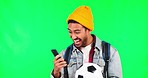 Young man, phone and celebration by green screen for success, football or results in studio mockup. Young Asian guy, student and smartphone for fintech, gambling and bonus with esports game on web