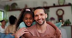 Family, face and father with girl child hug hug on a sofa happy, bonding and having fun in their home. Portrait, smile and parent with kid in a living room with love, care and sweet relationship