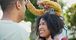 Family, piggyback and a girl playing with her parents outdoor in the garden together for love or bonding. Kids, smile or fun with a mother, father and happy daughter in the backyard for games