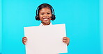 Advertising, portrait of a girl with poster and headset against a blue background happy. Branding or marketing, contact us or presentation and excited young female person with board for promotion 