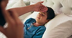 Phone call, parent and sick child with a fever in bed at a house, nursing flu or virus. Boy kid, illness and bedroom with a person, concern and hand on forehead while talking to family doctor contact