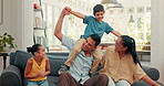 Together on sofa, family and children on dad shoulders for fun, bonding or quality time in living room with mom and girl. Couple, kids and laughing at funny game, balance or support in house