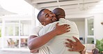 Senior African father, welcome and home with son, hug and love with kindness, bond and happy with care. Dad, black man and excited family with embrace, respect or conversation with smile in Cape Town