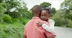 Back, walking and a father carrying his daughter from the street outdoor in their home while spending time together. Family, love or care with an african dad and girl in a residential neighborhood