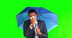Green screen, business and black man sneeze with umbrella for rain, winter season and bad weather. Health problem, sickness and male person with cold, flu and virus infection on commute in studio