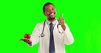 Doctor, apple and diet portrait with thumbs up and green screen with ok sign for health and wellness. Black man, healthy fruit and emoji hand sign with a smile and ok gesture for healthcare goal