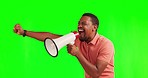 Black man, megaphone and shouting on green screen in protest, sale or discount against a studio background. African male person or activist screaming on big mic for strike or announcement on mockup