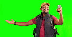Hiking, man and phone for video call on green screen with network connection, contact and communication for travel. Vlog, influencer or person talking with a mobile and backpack on studio background 