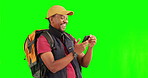 Green screen, travel and black man with phone photography on adventure, journey or happy memory of hiking with backpack. Smartphone, taking pictures and excited tourist trekking on tour or hike