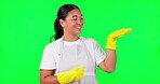 Cleaning, presentation and pointing with woman on green screen for idea, choice and decision. Advertising, hygiene and show with portrait of person on studio background for offer, opinion and mockup