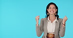 Business woman, fist and celebrate win or success on a blue background with a smile. Female entrepreneur excited or clapping hands emoji in studio for achievement, deal or promotion and announcement
