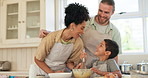 Father, mother and a child baking and learning with fun in a kitchen in a family home for development play. Mixed race man, woman and boy kid helping and cooking together for quality time activity