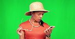Shock, woman and confused with fake news in portrait or studio with doubt in green background. Frustrated, omg and girl with cellphone is reading a text with notification and wtf or surprise. 