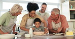Parents, grandparents and grandkids with a family baking in the kitchen of their home together during a visit. Love, teaching and children in a house with relatives for domestic cooking education