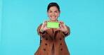 Green screen phone, presentation and happy woman show at mobile app mock up, contact info or branding space. Portrait, online media promo and studio person with social network app on blue background