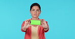 Green screen phone, studio face and serious woman show mockup design, online presentation and mobile app space. Portrait, smartphone UI software and person with digital tech logo on blue background