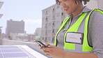 Phone, woman and solar engineer on roof, typing or social media with smile on break. Smartphone, contractor and African person person texting, communication or networking outdoor for renewable energy