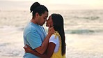 Kiss, hug and couple with love, beach and quality time on holiday, romantic gesture and commitment. Romance, man and woman embrace, seaside vacation and dating with care, loving together and travel