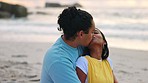 Love, romance and a couple kissing on the beach outdoor during summer while on holiday or vacation together. Travel, date or anniversary with a young man and woman bonding at the coast by the ocean