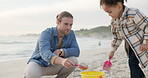 Playing, father and child at the beach for a sand castle, creative game and helping on holiday. Family, travel and a dad with a girl kid and gear for vacation at the ocean in summer together