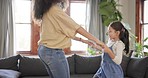 Dance, love and mother with girl in home for bonding, quality time and loving relationship. Family, happy parents and mom with child in living room for dancing spin, learning and teaching moves 