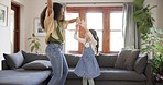 Dance, excited and mother with daughter in home for bonding, quality time and loving relationship. Family, happy parent and mom with child in living room for dancing, learning and teaching moves 