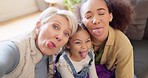 Happy family, tongue out and selfie on sofa with mother, grandmother and girl child in their home. Face, love and portrait of interracial women in living room for photo, fun or silly profile picture