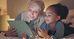 Grandmother, child and tablet on bed, night and together for learning, reading or bedtime story in family home. Senior woman, young kid and digital touchscreen for movies, typing or game in bedroom