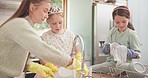 Mom, girl kids and cleaning dishes in home kitchen for hygiene, germs or dirt with teamwork. Mama, children and cloth for washing, listen and learning together for skills in gloves, chat or helping