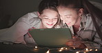 Tablet, night and mother with daughter in bedroom for storytelling, streaming and watching movies. Happy, internet and technology with woman and girl in family home for subscription, online and media