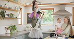 Crazy, happy family and parents dancing with kids or playing in a kitchen together and excited for a meal in a home. Tutu, mother and father with energy bonding with children love, care and happiness