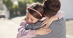 Dad, girl and hug after school in street outdoor, bonding and happy together. Father, embrace and cuddle with kid for love, care and affection, trust and welcome with family, security and comfort.