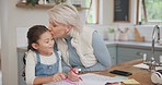 Love, happy and grandmother drawing with her grandchild in the kitchen for creative art at home. Education, bonding and senior woman kissing a child while helping with school homework at family house