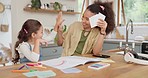 High five, homework cards and a mother teaching her daughter in the living room of their home for distance learning. Kids, remote or private education with a woman teacher and student girl in a house