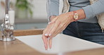 Soap, water and a woman washing hands in the kitchen of her home for skincare or hydration. Health, cleaning and hygiene with a senior female person at the tap to remove bacteria from her skin