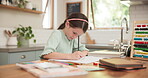 Drawing, writing and girl child with homework at a home table for education and learning. Young girl, school kid or student with a pencil for math or creative project for development with abacus