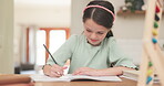 Writing, book and girl child with homework at a table for education and learning. Young girl, school kid or student with a pencil for math or creative project for development with abacus