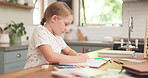 Education, girl and colouring is creative with homework at house for childhood development with pencil. Kid, learning and knowledge with drawing on paper at family home for growth or motor skills.