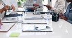 Business people, hands and documents in meeting for team planning, strategy or discussion on office desk. Hand of employee group with paperwork in teamwork, project plan or collaboration at workplace